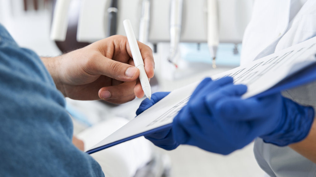 Patient filling out dental forms